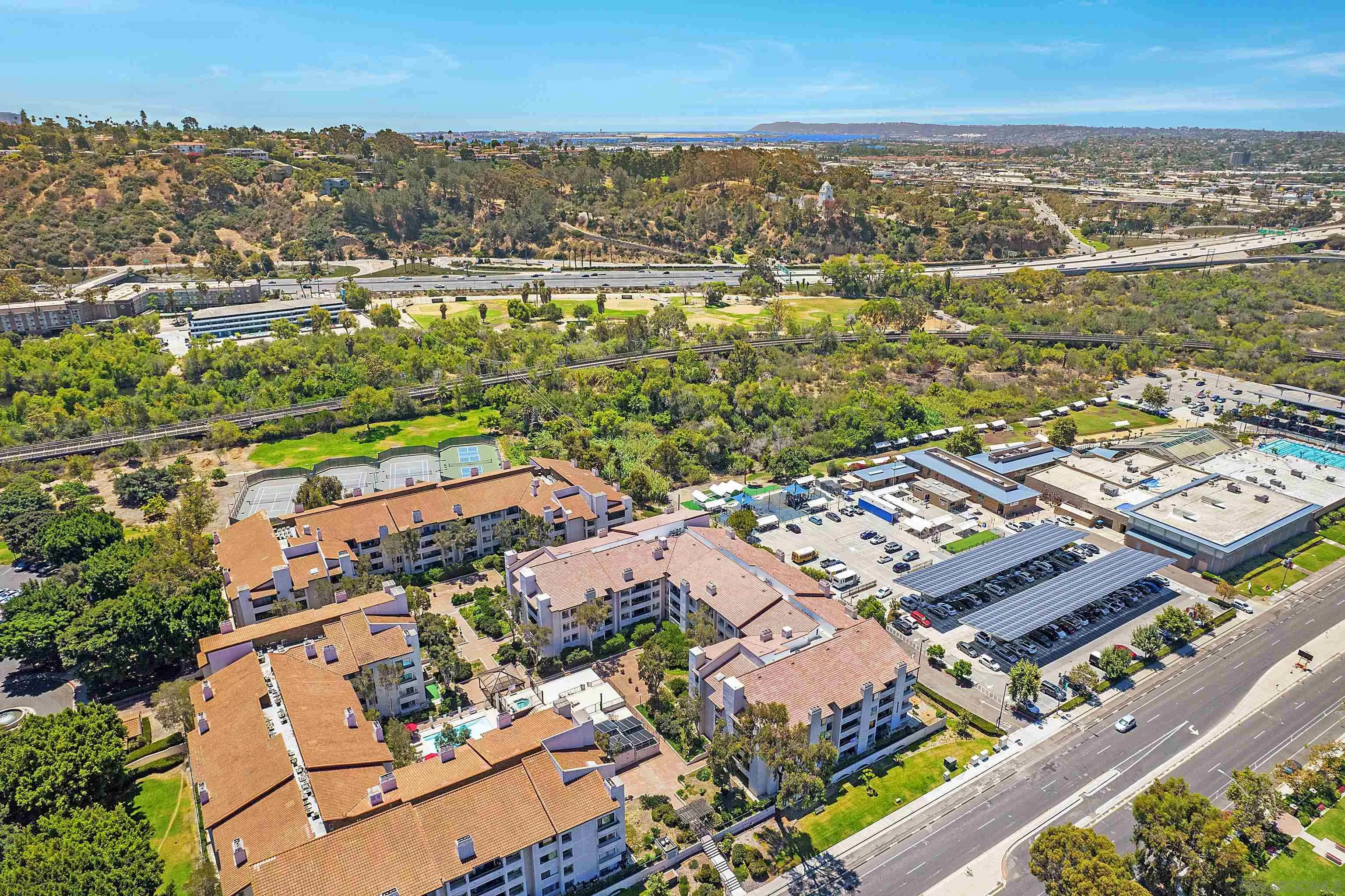 5605 Friars Road, Unit 304 San Diego, CA 92110 - Photo 30 of 37 an aerial view of residential building and lake