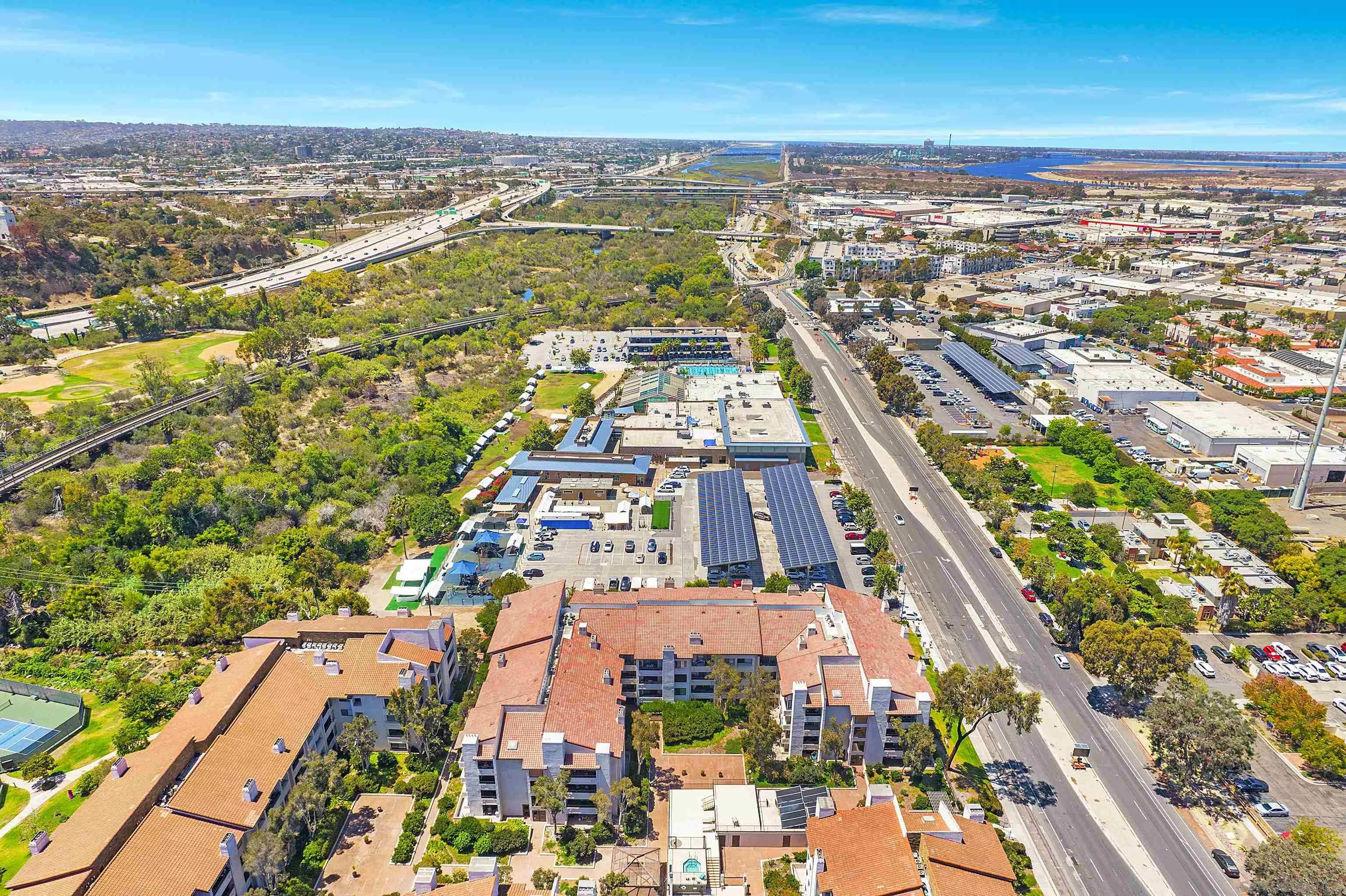5605 Friars Road, Unit 304 San Diego, CA 92110 - Photo 31 of 37 an aerial view of residential houses with outdoor space