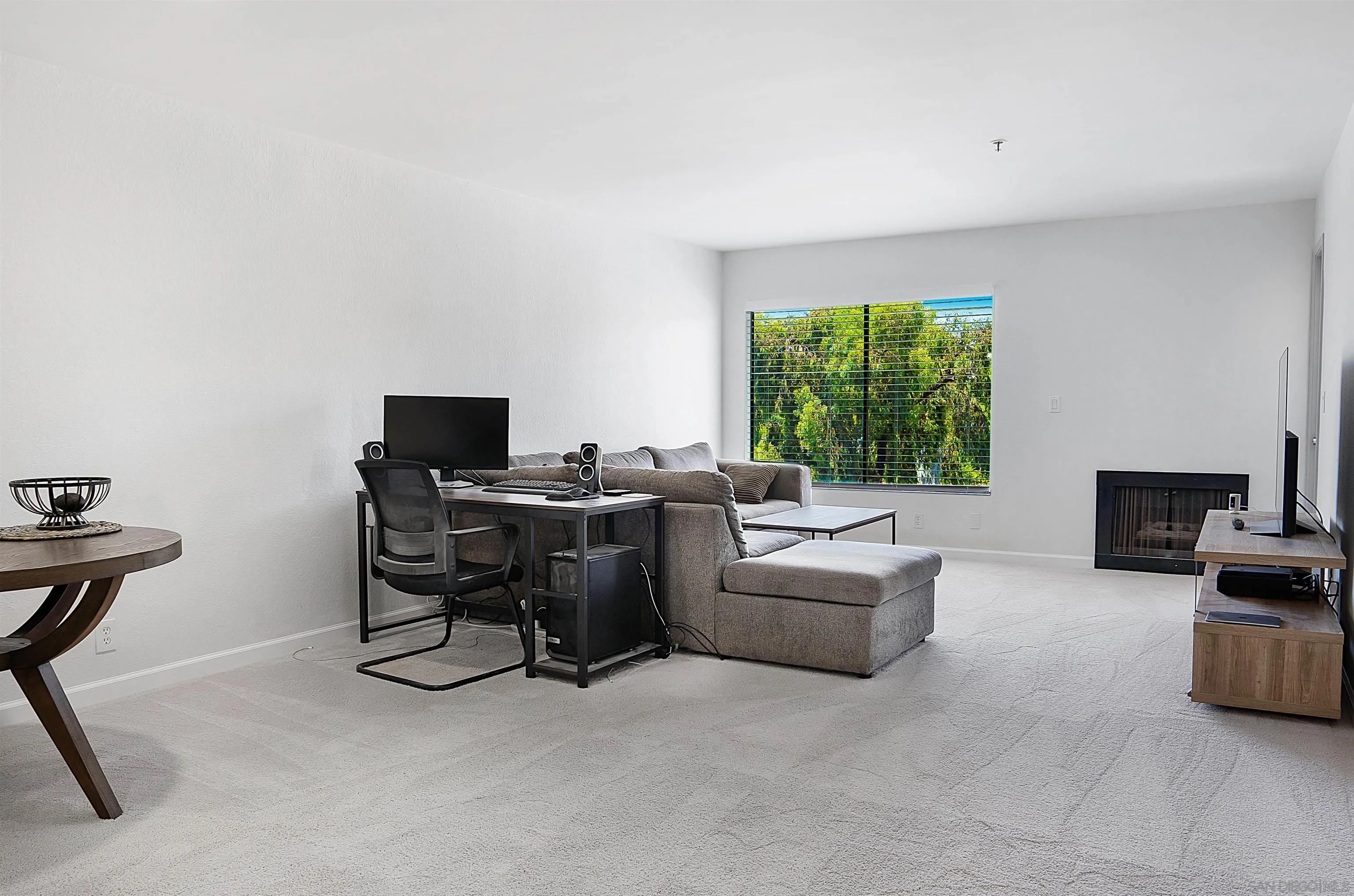 5605 Friars Road, Unit 304 San Diego, CA 92110 - Photo 5 of 37 a view of a livingroom with workspace and a window
