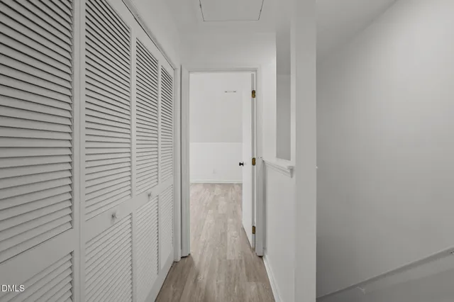 a view of a bathroom from the hallway