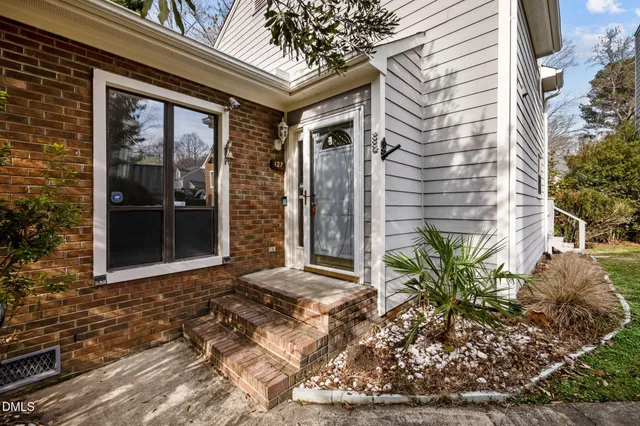 aerial view of a house with a yard