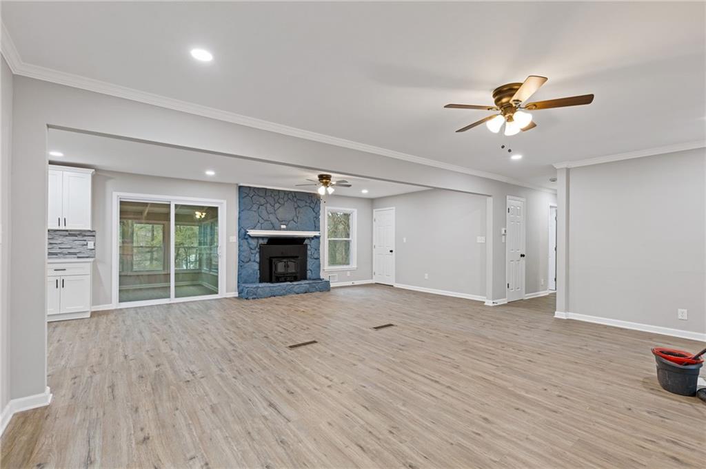 2224 Hudson Drive Southwest Lilburn, GA 30047 - Photo 6 of 30 a view of an empty room with a window and a kitchen