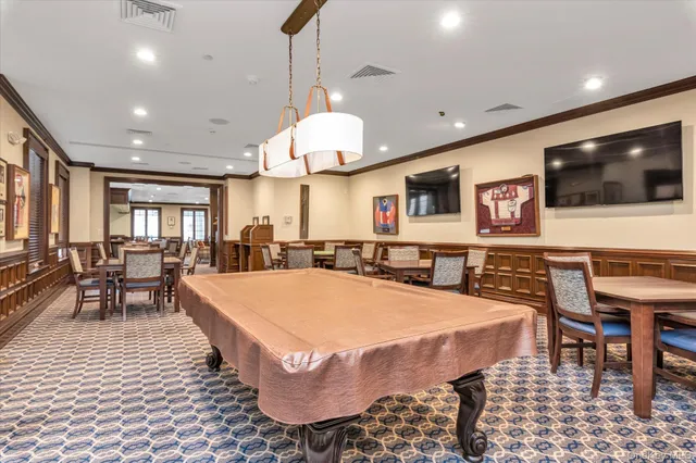 a large kitchen with a table and chairs in it