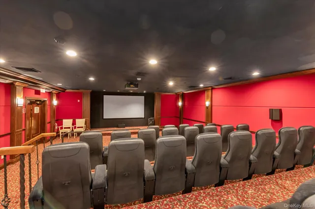 a room with furniture projector and screen