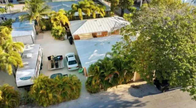 a view of a car park in front of house