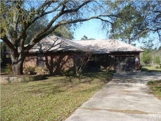 FRONT OF HOME WITH LARGE OAK TREES LOCATED ON .50 OF AN ACRE-SIMPLY BEAUTIFUL