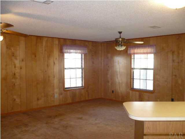 PLENTY OF SPACE IN THIS FAMILY ROOM AND HAS ENTRANCE TO BACK PORCH AREA