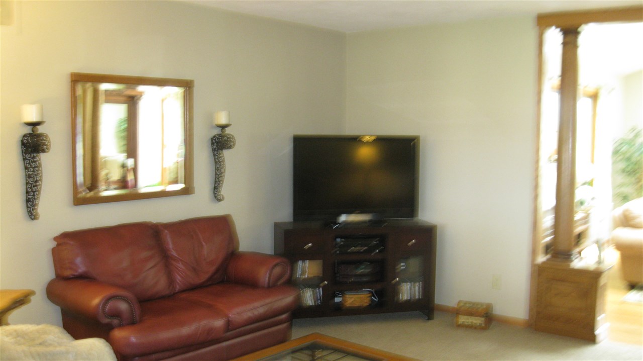 5549 North Stillman Road Stillman Valley, IL 61084 - Photo 11 of 22 a living room with furniture and a flat screen tv