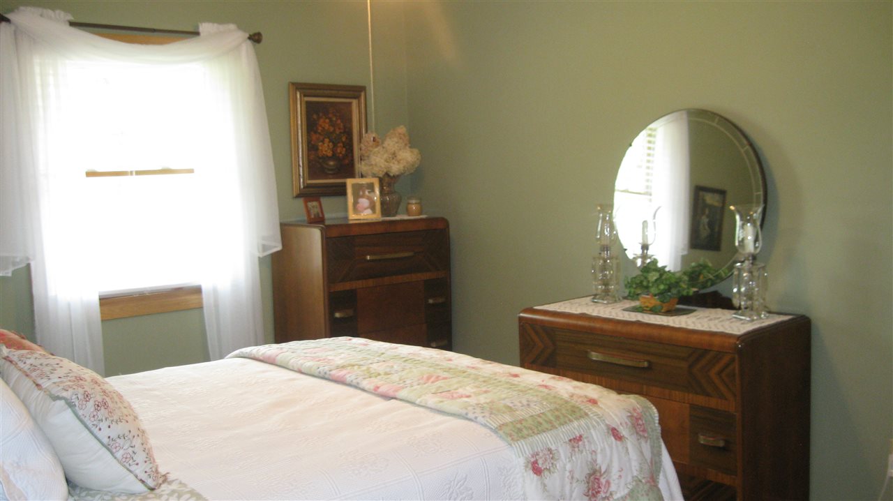 5549 North Stillman Road Stillman Valley, IL 61084 - Photo 15 of 22 a bedroom with a bed and a dresser
