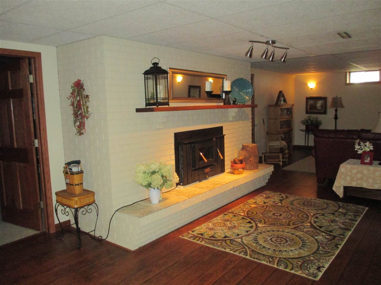 5549 North Stillman Road Stillman Valley, IL 61084 - Photo 19 of 22 a living room with furniture and a fireplace