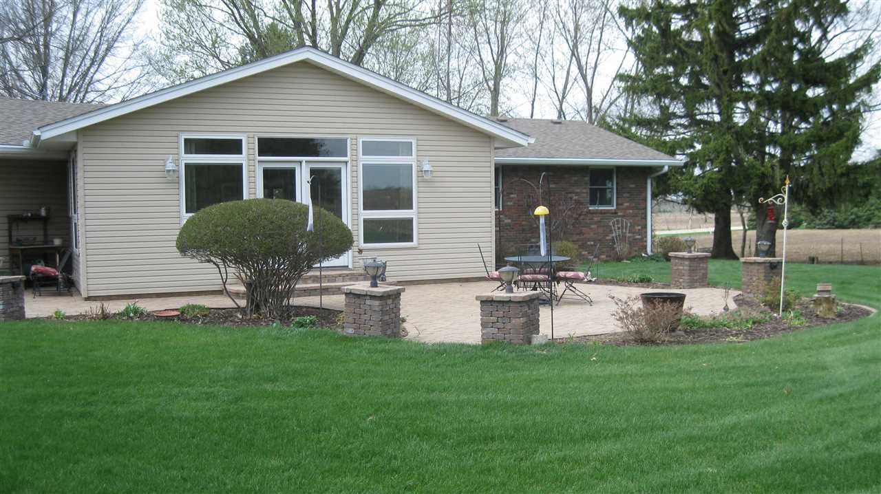 5549 North Stillman Road Stillman Valley, IL 61084 - Photo 3 of 22 a front view of house with backyard and garden