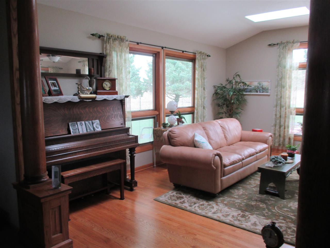 5549 North Stillman Road Stillman Valley, IL 61084 - Photo 5 of 22 a living room with furniture a flat screen tv and a window