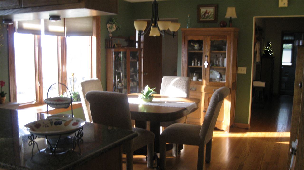 5549 North Stillman Road Stillman Valley, IL 61084 - Photo 8 of 22 a view of a dining room with furniture window and outside view