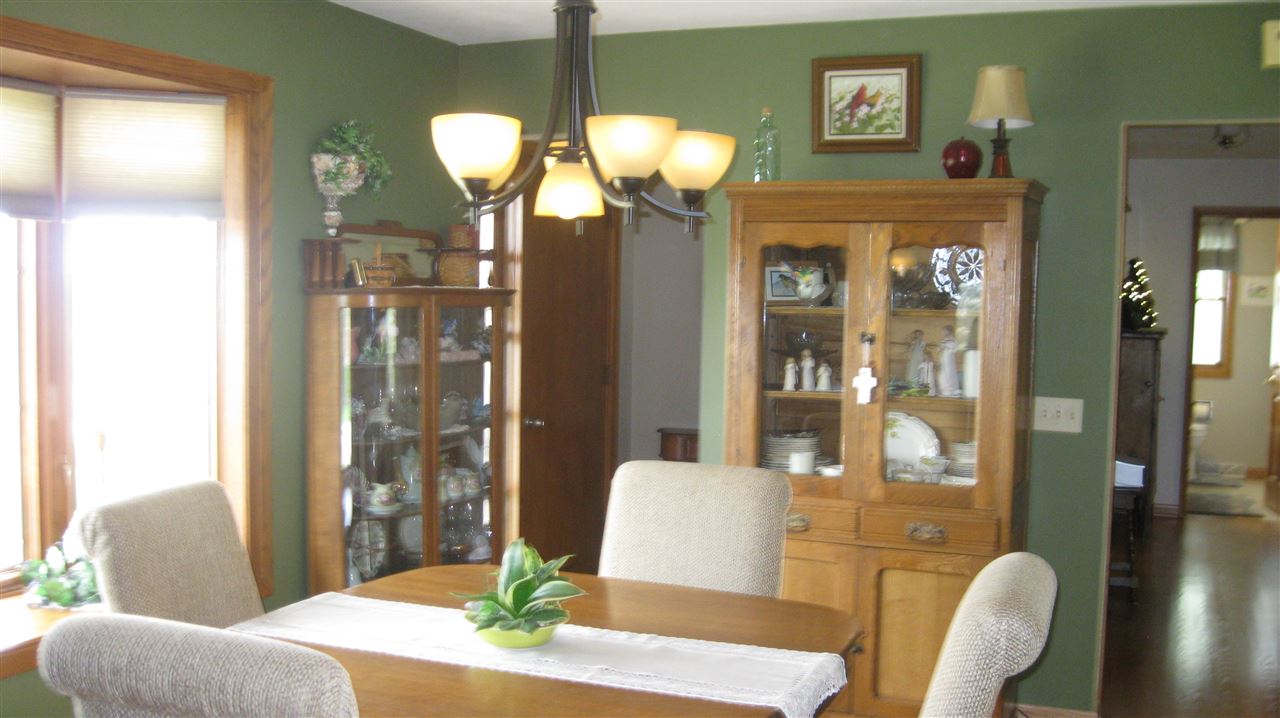 5549 North Stillman Road Stillman Valley, IL 61084 - Photo 9 of 22 a living room with furniture and a chandelier