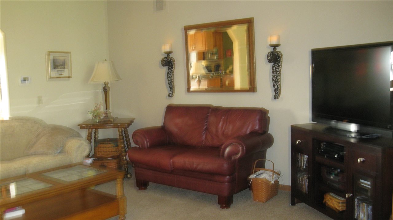 5549 North Stillman Road Stillman Valley, IL 61084 - Photo 10 of 22 a living room with furniture and a flat screen tv
