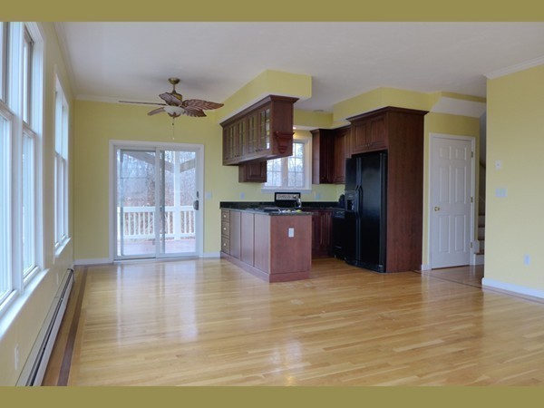25 Sheppard Road Bourne, MA 02562 - Photo 8 of 18 a kitchen with stainless steel appliances granite countertop a refrigerator and a sink