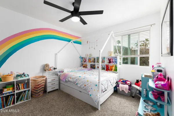 a bedroom with bed and a window