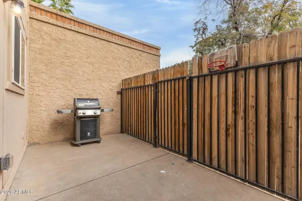 a view of a porch with wooden fence