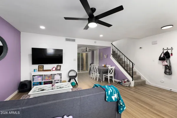 a living room with furniture and a flat screen tv