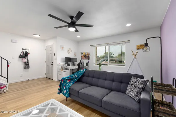 a living room with furniture and a large window