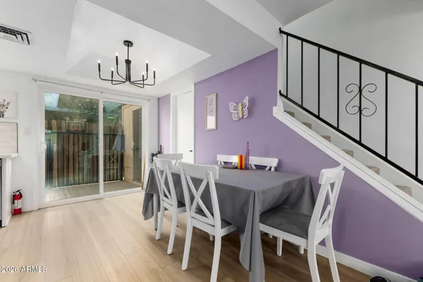 a view of a dining room with furniture and wooden floor