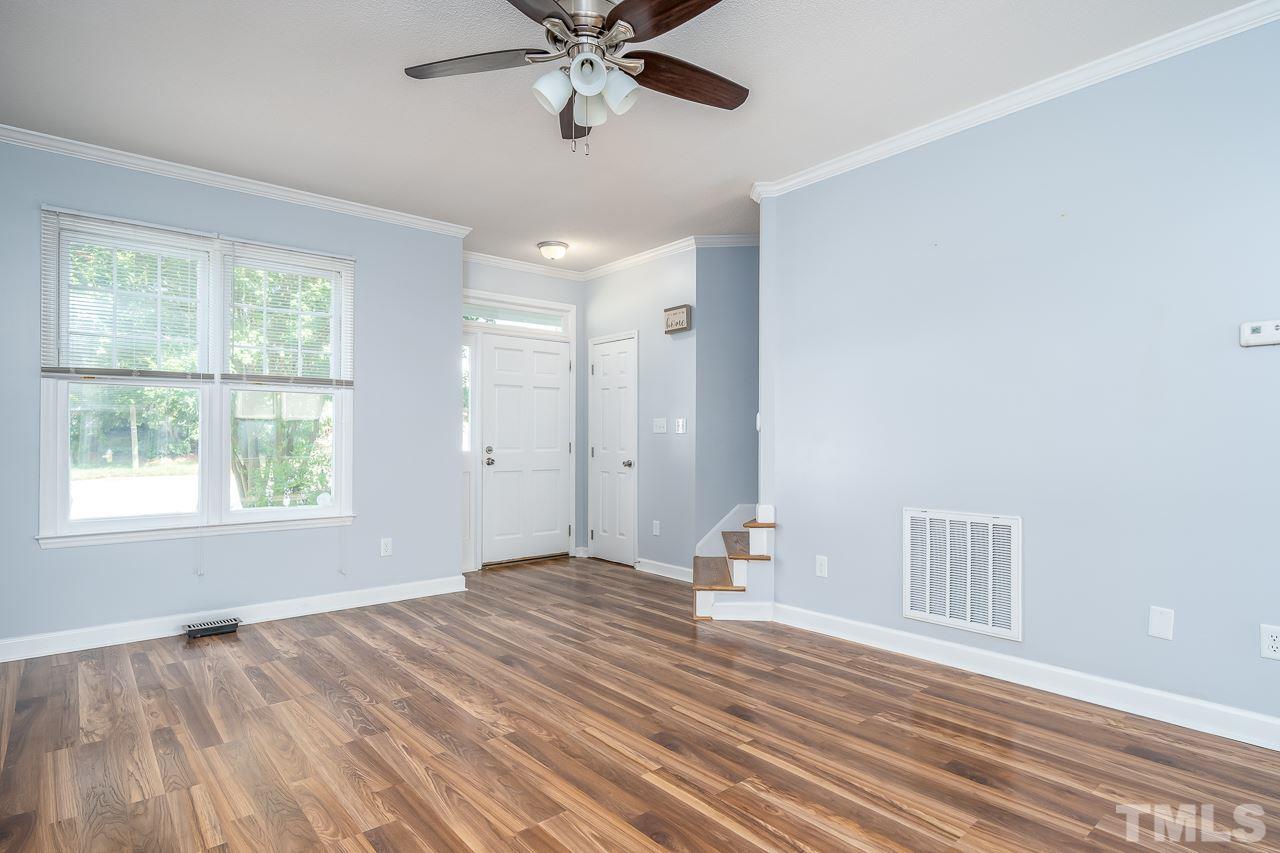 4500 Knightsbridge Way Raleigh, NC 27604 - Photo 2 of 24 a view of empty room with wooden floor and fan