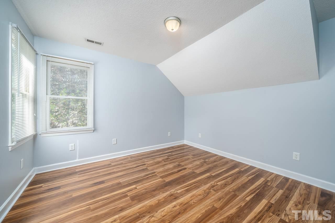 4500 Knightsbridge Way Raleigh, NC 27604 - Photo 11 of 24 a view of a room with wooden floor and fan