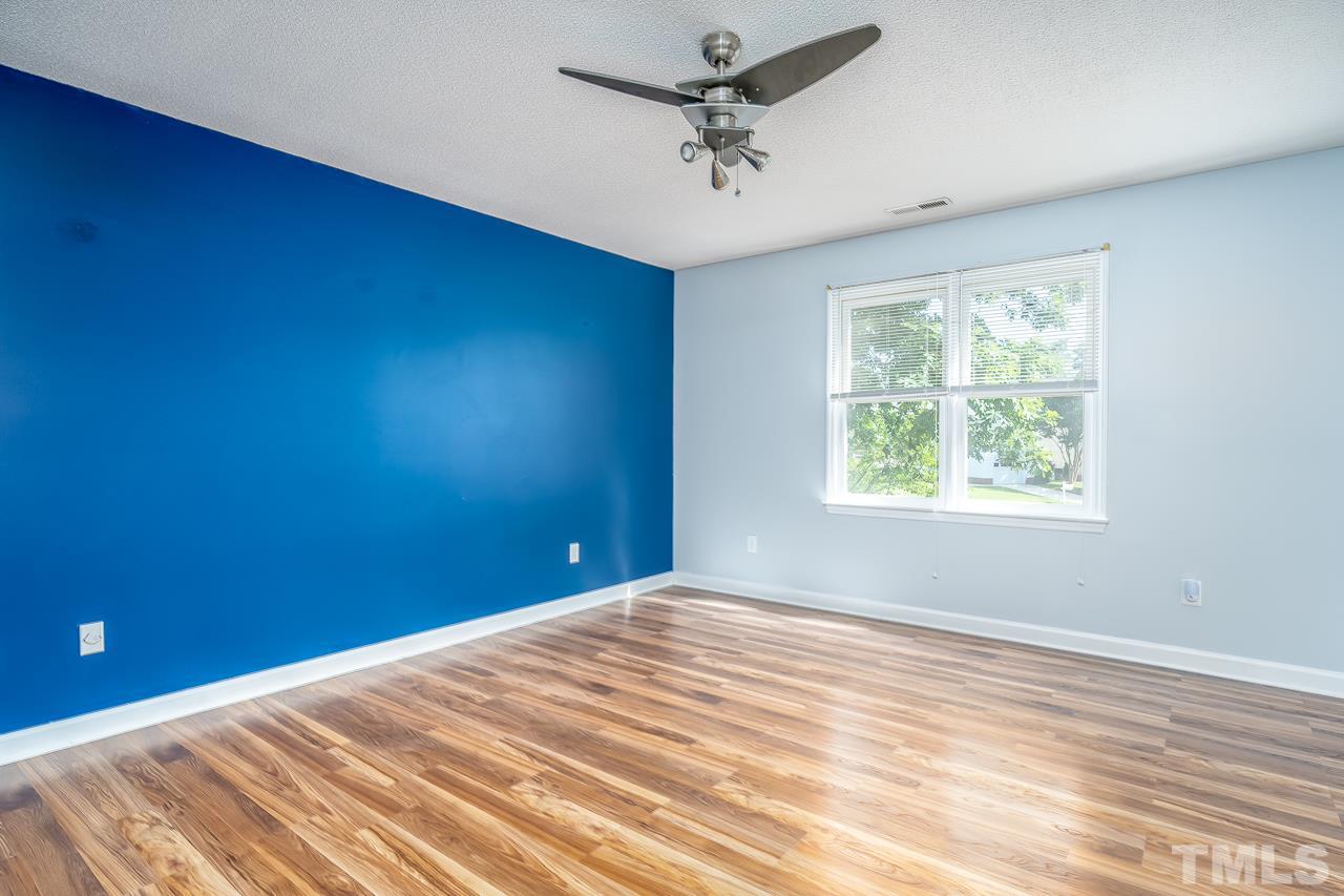 4500 Knightsbridge Way Raleigh, NC 27604 - Photo 17 of 24 a view of a big room with windows and chandelier fan