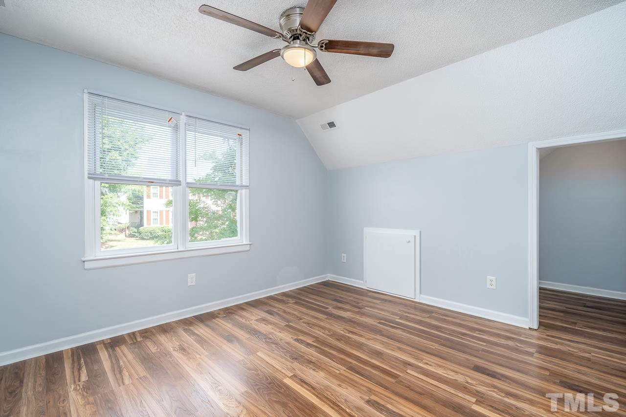 4500 Knightsbridge Way Raleigh, NC 27604 - Photo 10 of 24 a view of empty room with wooden floor and fan