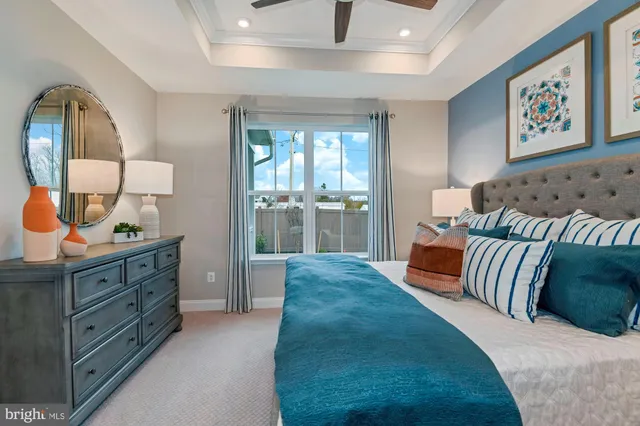 a spacious bedroom with a bed and window