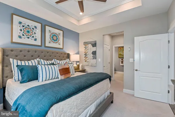 a bedroom with a bed and wall painting