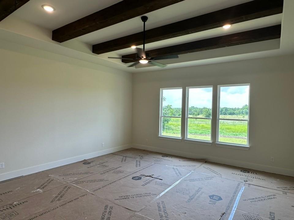 205 Cobb Road Leonard, TX 75452 - Photo 14 of 23 Tray ceiling with exposed wood-finish beams, recessed lighting, and a ceiling fan