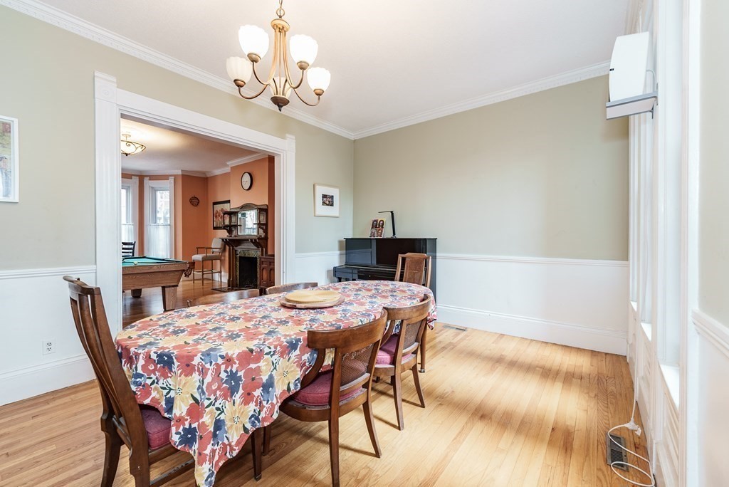 19 Mattoon Street Springfield, MA 01105 - Photo 11 of 42 a dining room with a wooden table and chairs