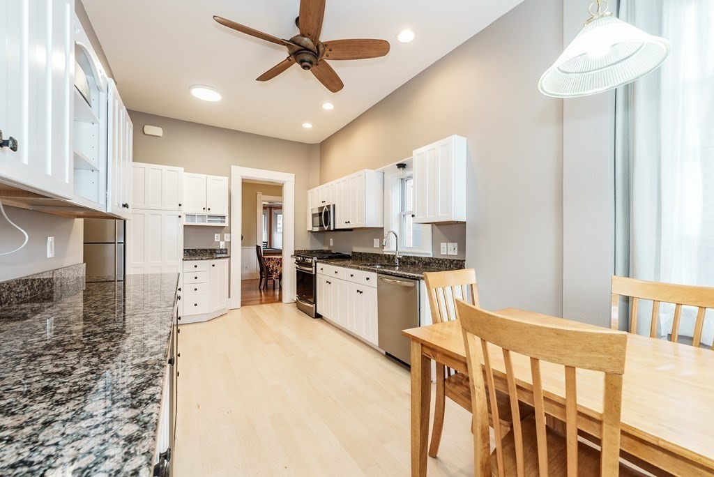 19 Mattoon Street Springfield, MA 01105 - Photo 18 of 42 a kitchen with stainless steel appliances a refrigerator sink and cabinets