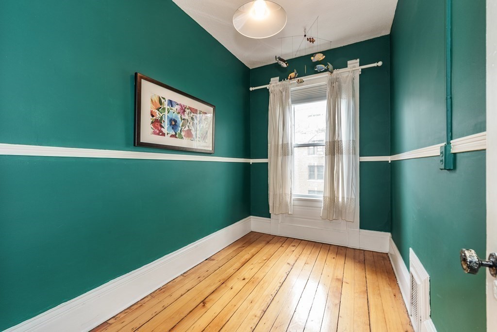 19 Mattoon Street Springfield, MA 01105 - Photo 20 of 42 a view of a room with window and wooden floor
