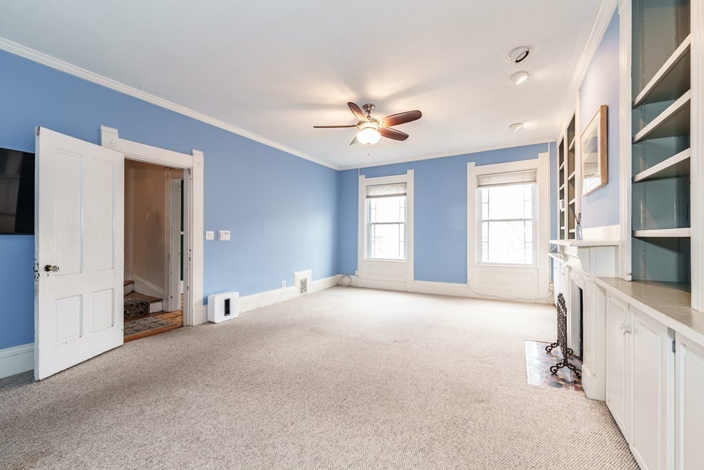 19 Mattoon Street Springfield, MA 01105 - Photo 23 of 42 a view of a livingroom with a ceiling fan and window