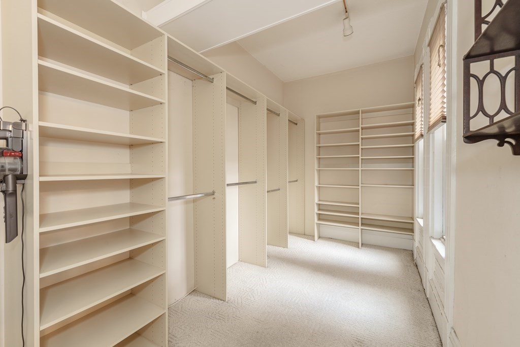 19 Mattoon Street Springfield, MA 01105 - Photo 26 of 42 a view of walk in closet with empty racks