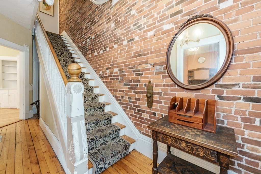 19 Mattoon Street Springfield, MA 01105 - Photo 3 of 42 a view of a balcony with wooden floor