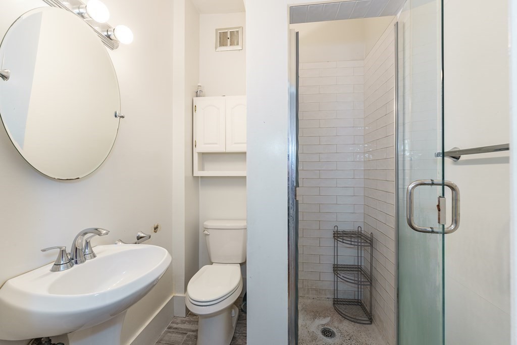 19 Mattoon Street Springfield, MA 01105 - Photo 33 of 42 a bathroom with a sink toilet and shower