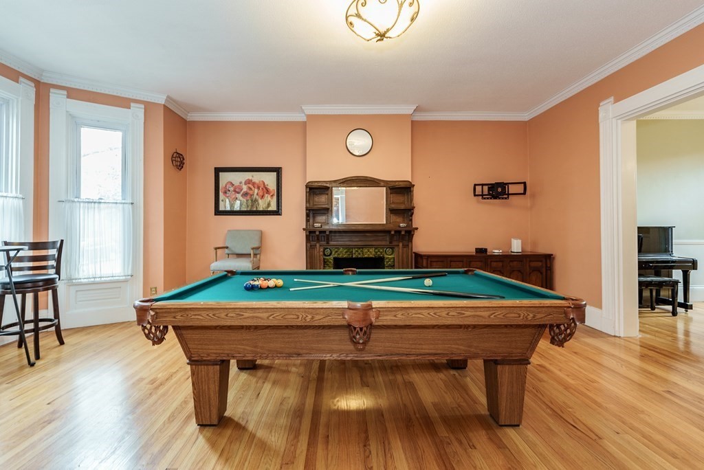 19 Mattoon Street Springfield, MA 01105 - Photo 5 of 42 a room with furniture and a wooden floor