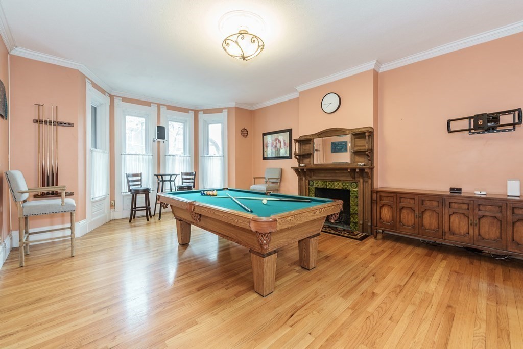 19 Mattoon Street Springfield, MA 01105 - Photo 6 of 42 a living room with furniture and a wooden floor