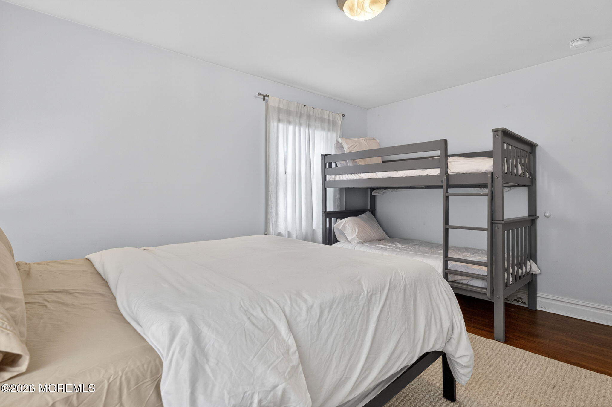 65 Heck Avenue Ocean Grove, NJ 07756 - Photo 28 of 37 a bedroom with a bed and a window