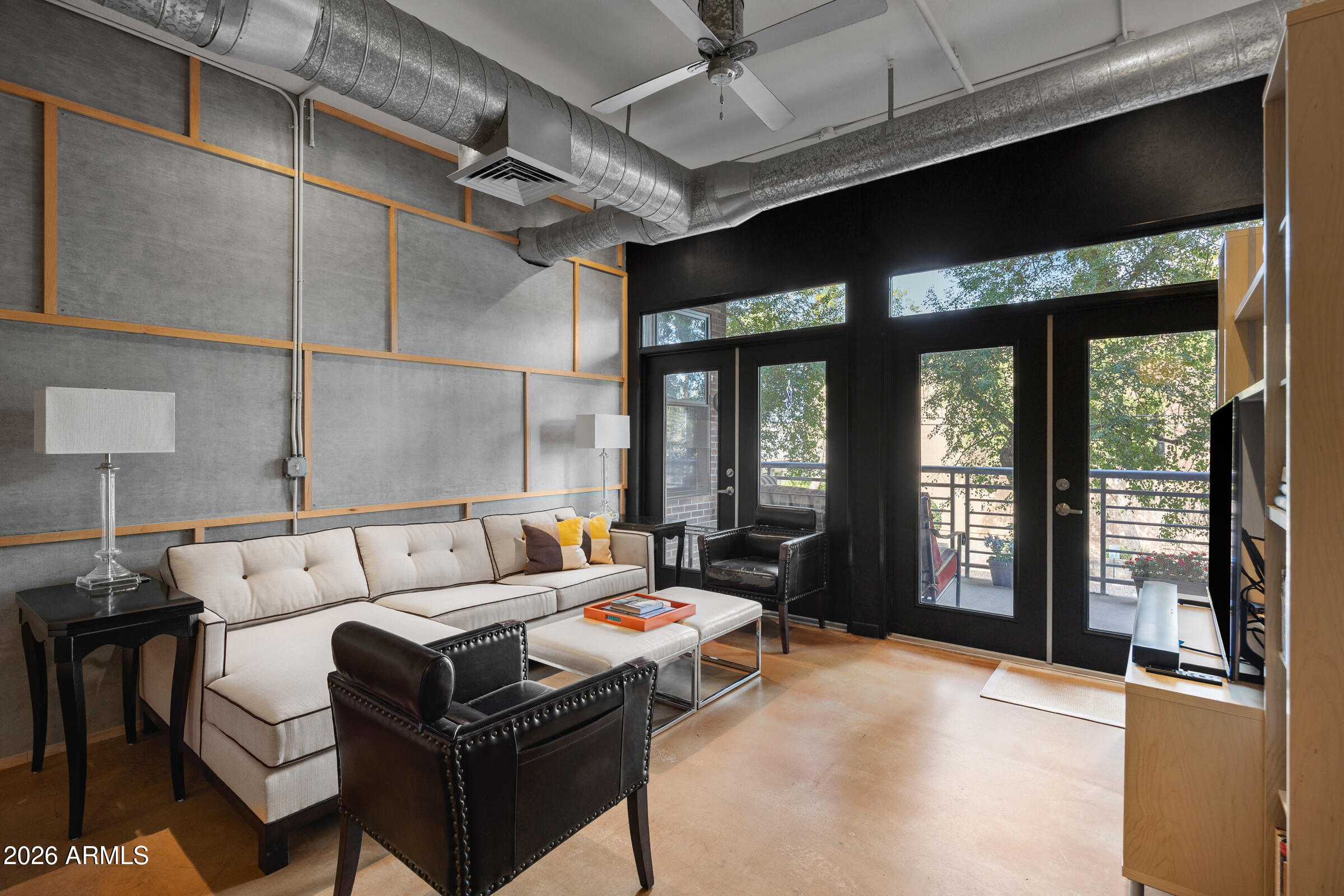 914 East Osborn Road, Unit 216 Phoenix, AZ 85014 - Photo 11 of 26 a living room with furniture a large window with outer view