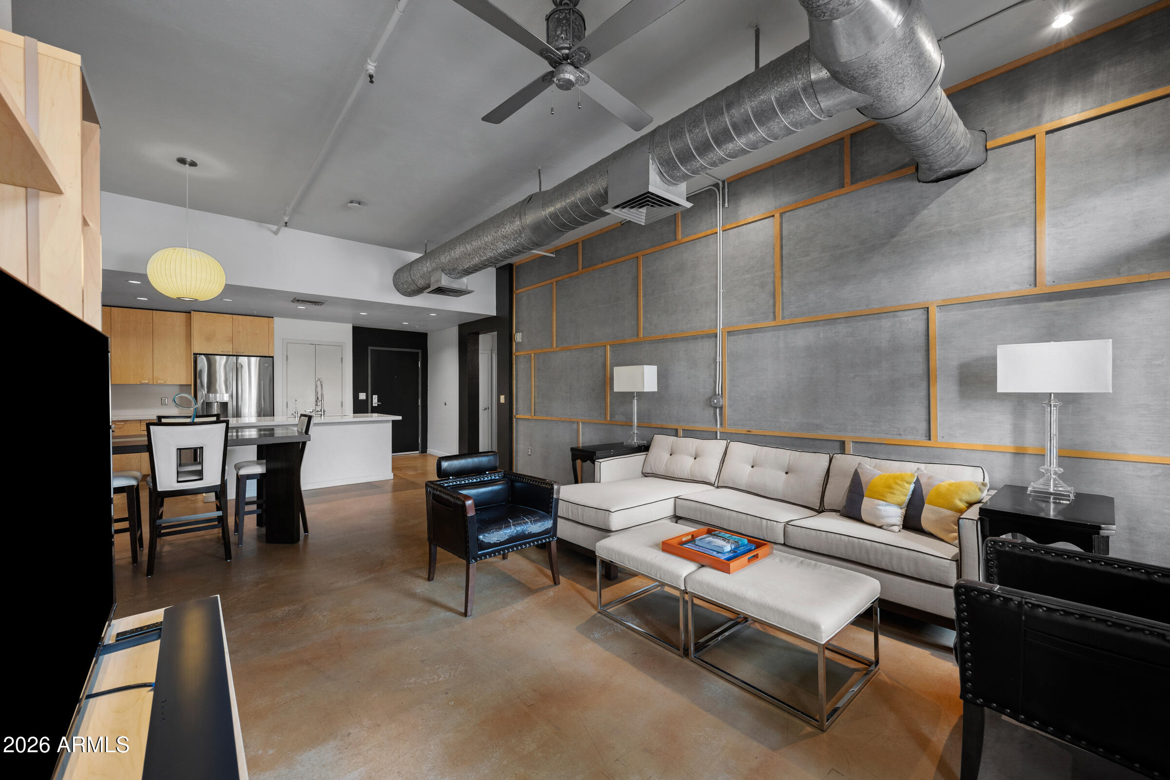 914 East Osborn Road, Unit 216 Phoenix, AZ 85014 - Photo 12 of 26 a living room with lots of furniture and kitchen view