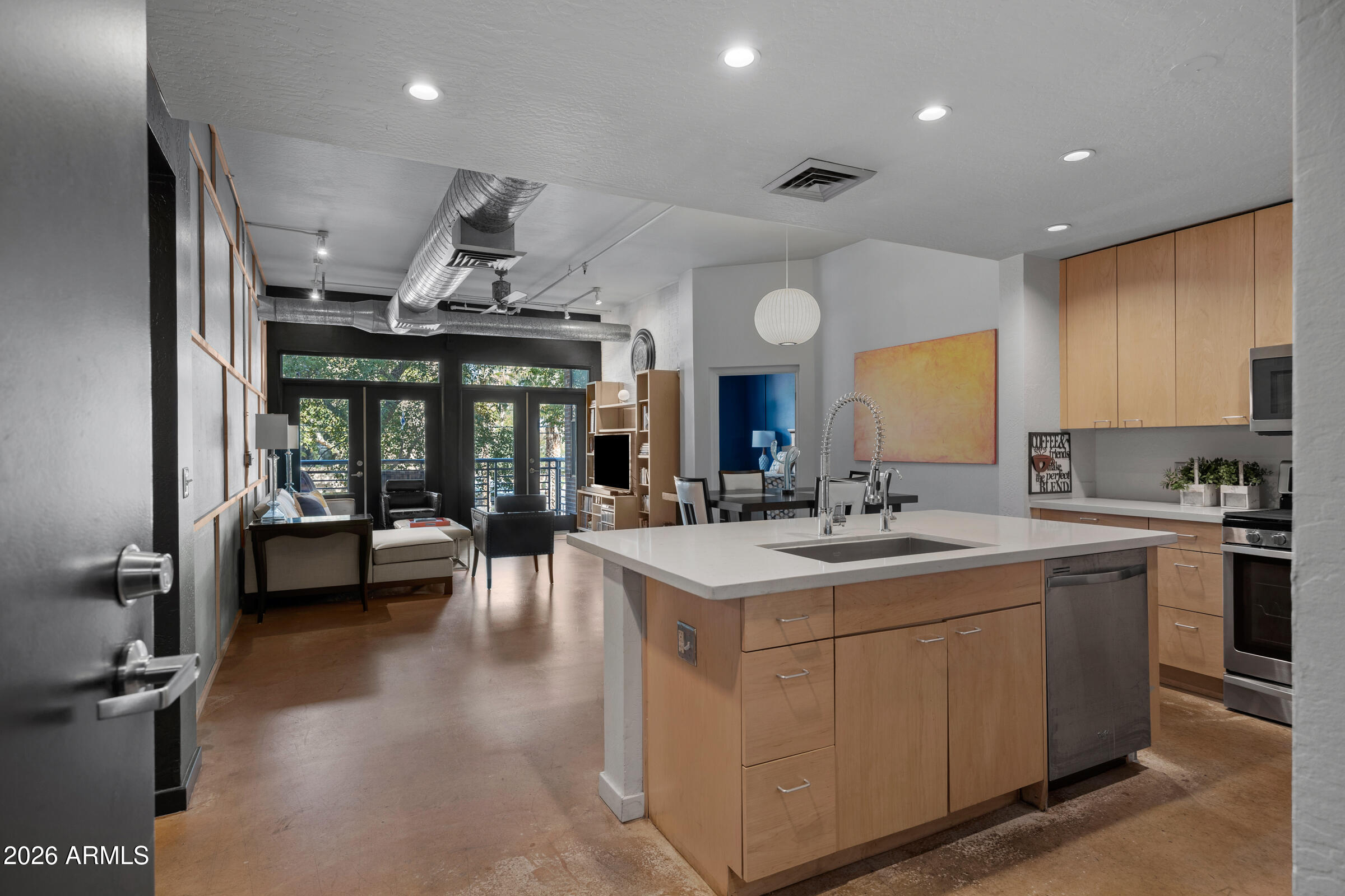 914 East Osborn Road, Unit 216 Phoenix, AZ 85014 - Photo 2 of 26 a kitchen with stainless steel appliances a sink stove and cabinets