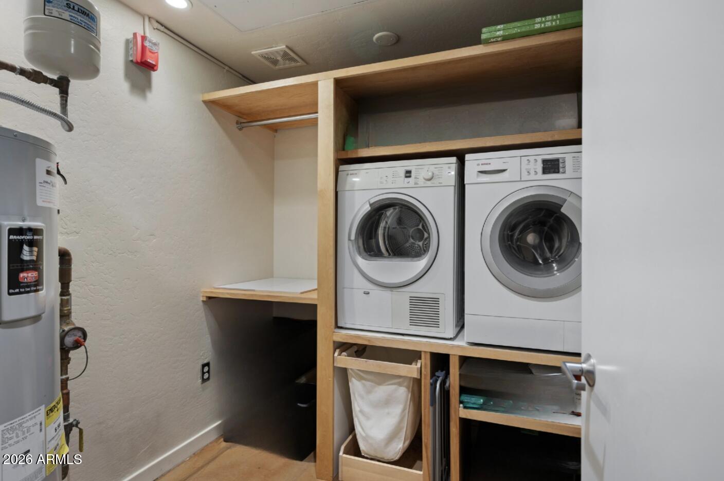 914 East Osborn Road, Unit 216 Phoenix, AZ 85014 - Photo 23 of 26 a utility room with dryer and washer