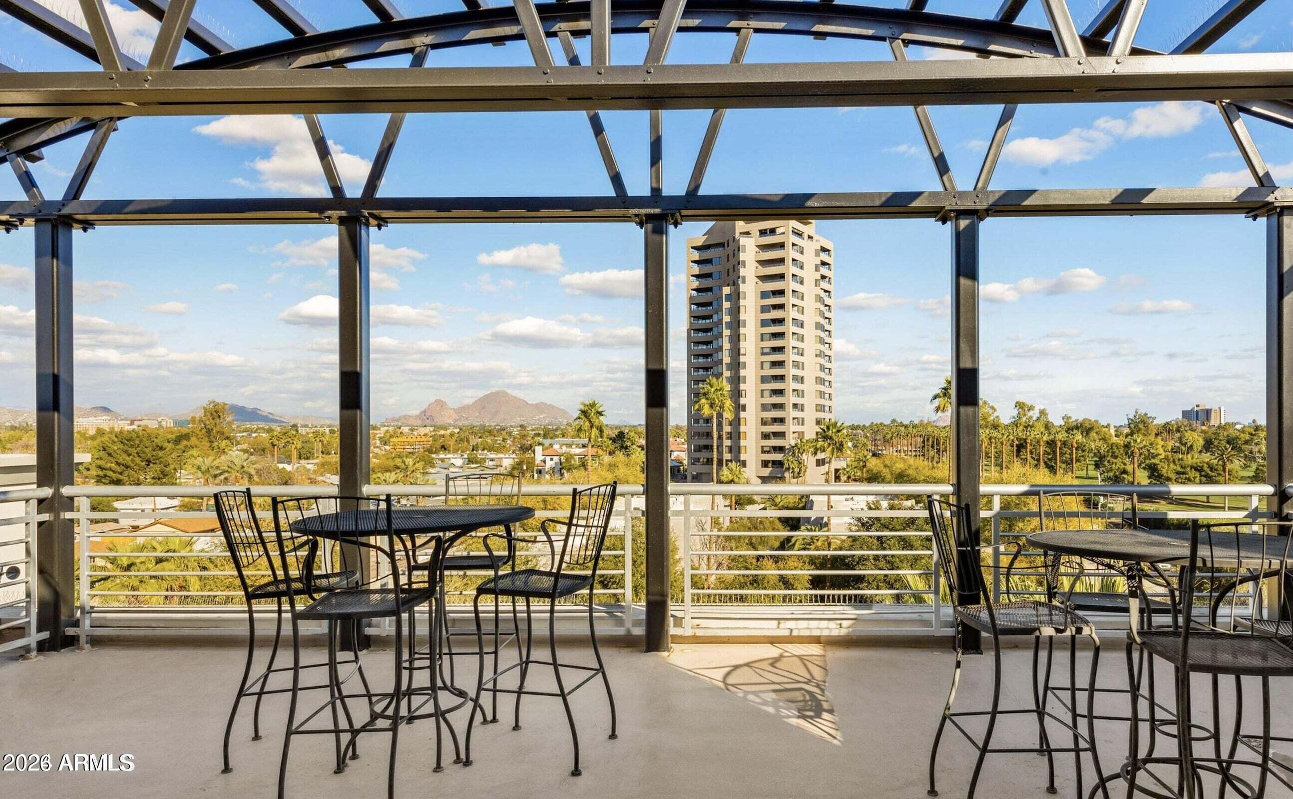 914 East Osborn Road, Unit 216 Phoenix, AZ 85014 - Photo 25 of 26 an outdoor view from a balcony with furniture