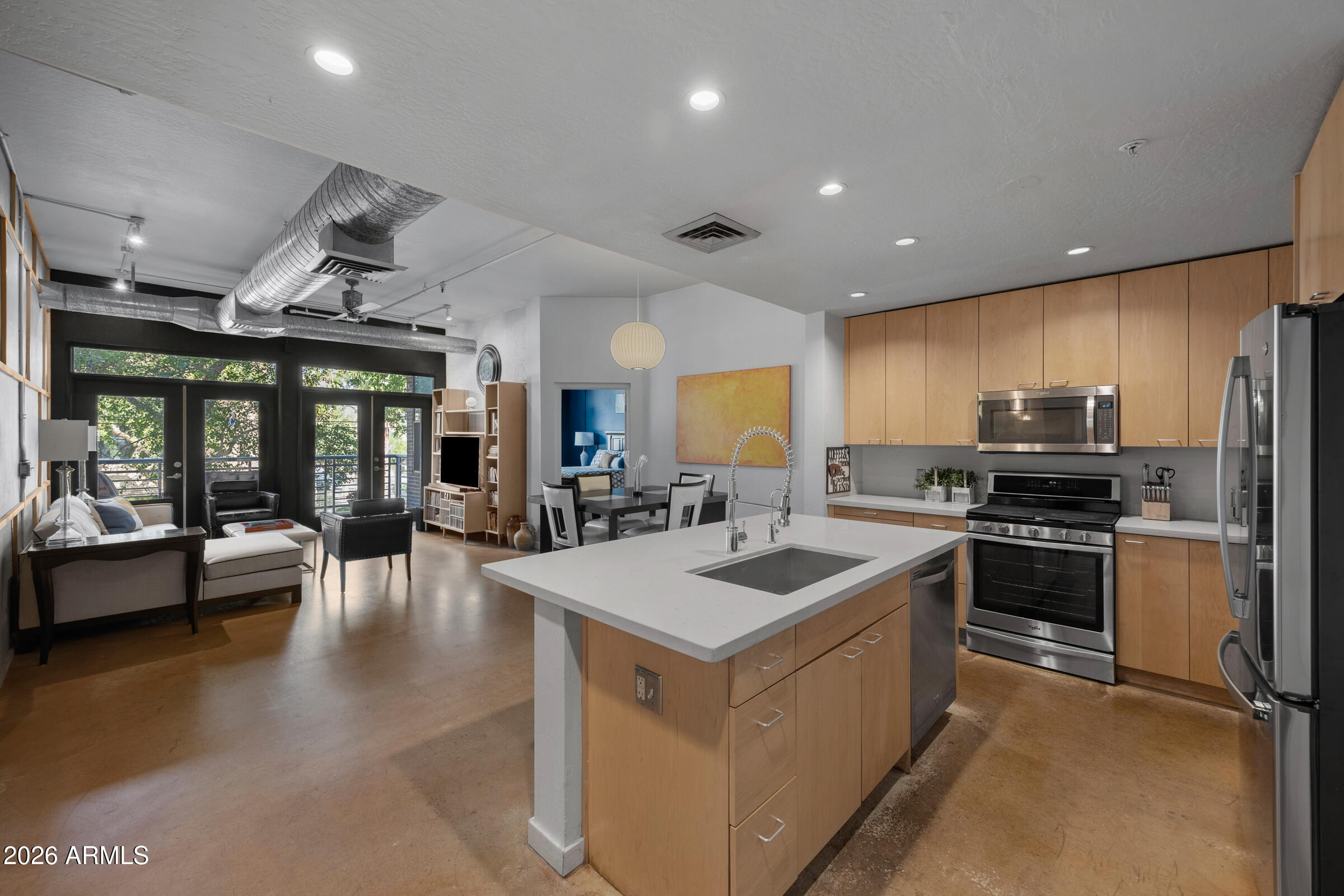 914 East Osborn Road, Unit 216 Phoenix, AZ 85014 - Photo 3 of 26 a kitchen with stove and refrigerator