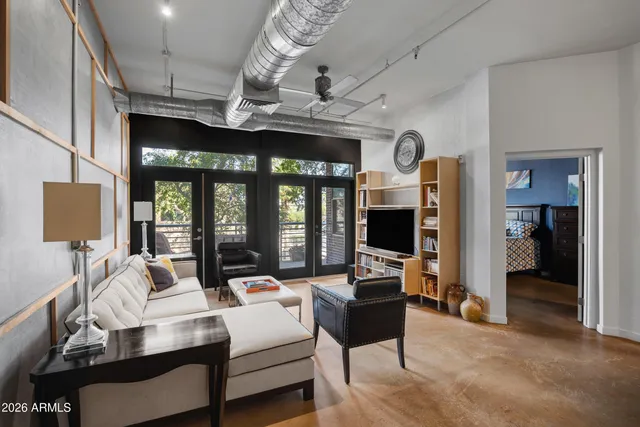 a living room with furniture fireplace and flat screen tv