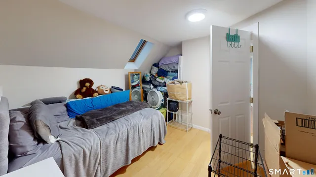 a bed room with a bed and a window